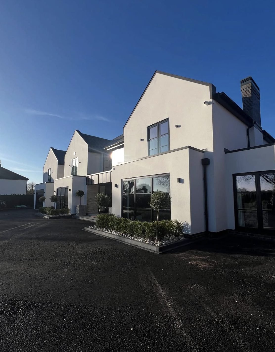 Row of new houses in off-white render